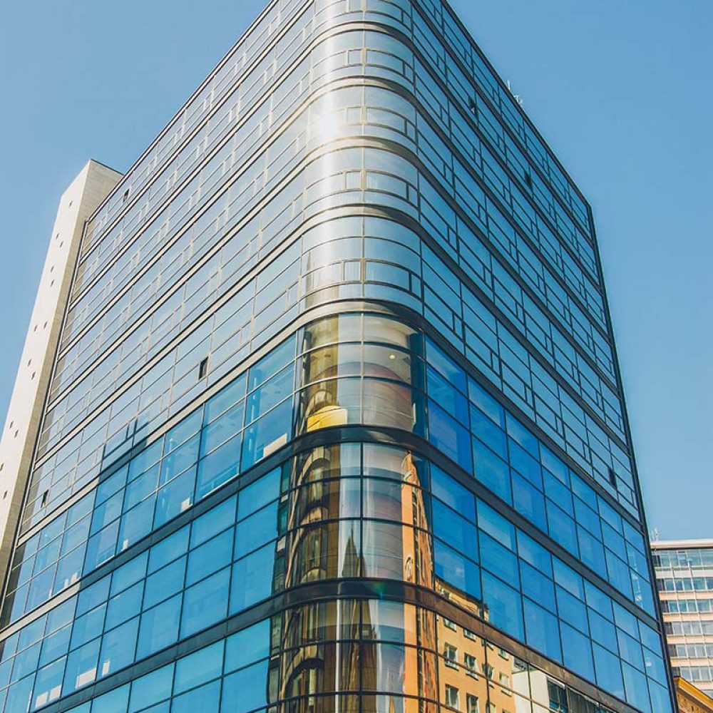 low-angle-view-of-modern-office-building-against-b-2023-11-27-05-37-12-utc-copy.jpg